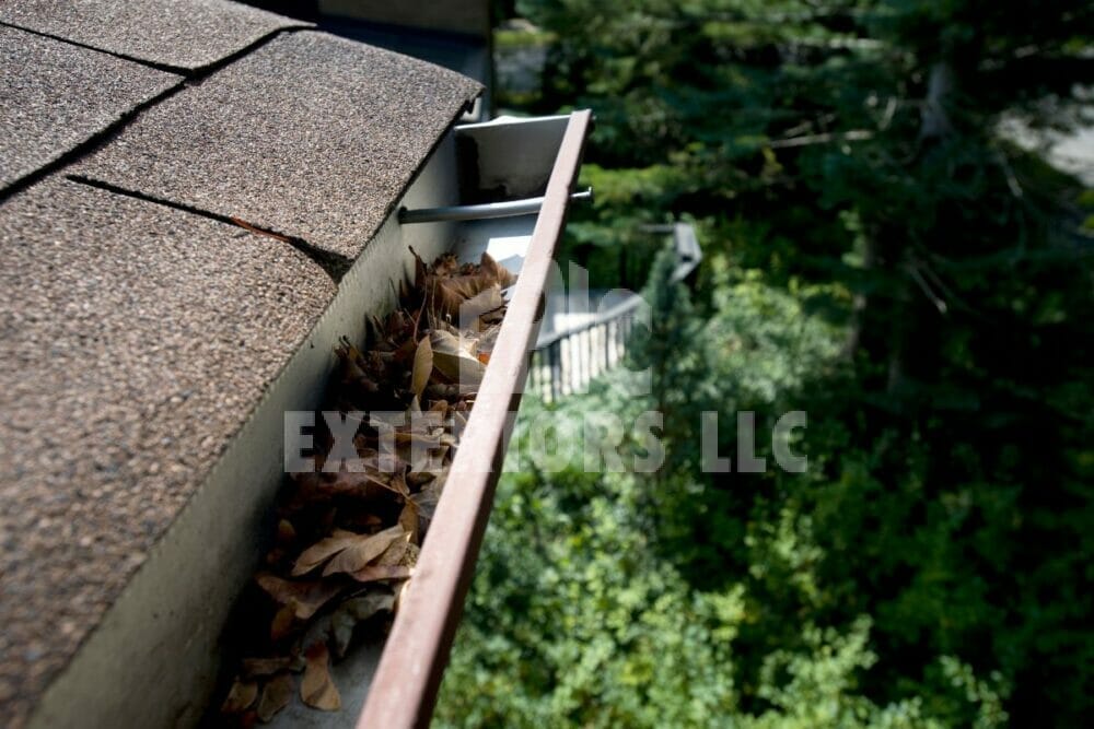 How Long Do Gutters Last? Channels, Downspouts & Other Parts 5 Clogged gutters